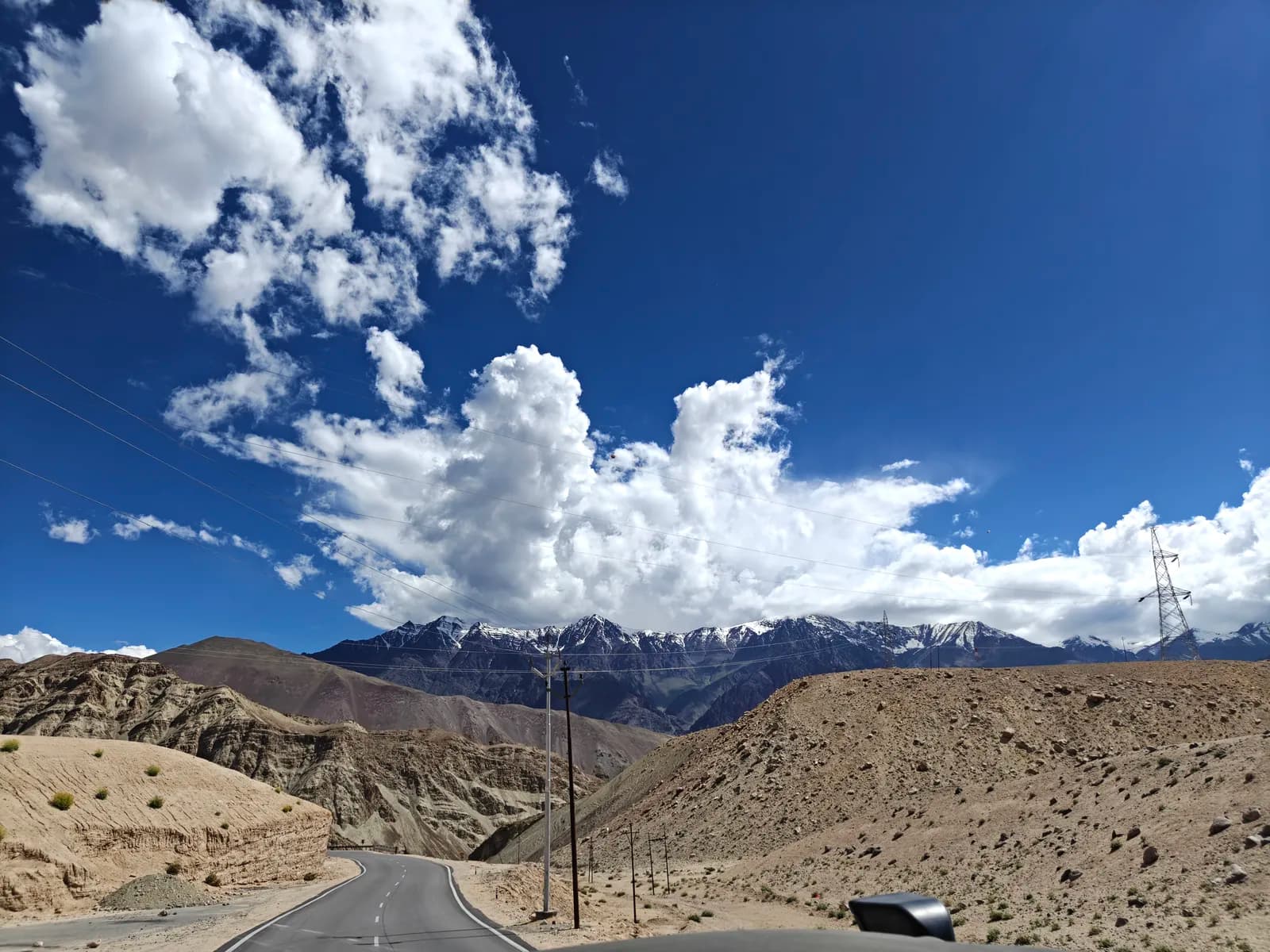Open mountain highway under a deep blue Ladakh sky
